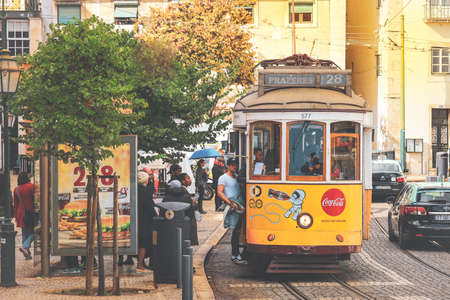 LISBON - PORTUGAL, December 23, 2019: An old traditional tram carriage in the city centre of Lisbon,...