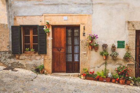 Valldemossa typical village with plants pots in facades at Mallorca island, Spainの写真素材