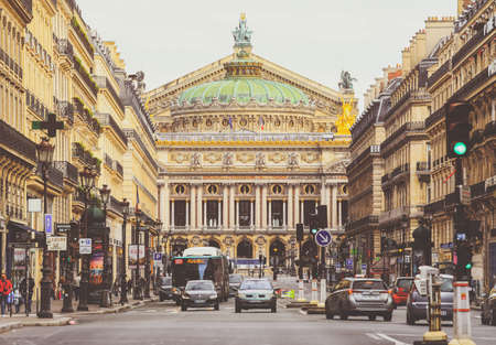 Paris, France - May 6, 2019 : Front view of the Old Garnier Opera house in Paris with people and cars on the busy streetのeditorial素材