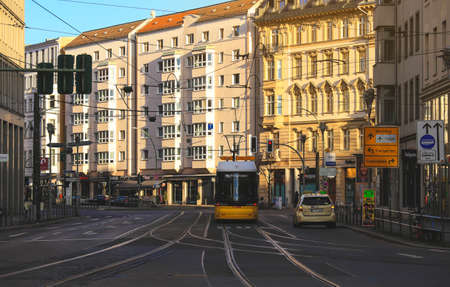 Berlin, Germnay - January 2, 2018 : Yellow  public transportation tram passing by the city of Berlin Germanyのeditorial素材