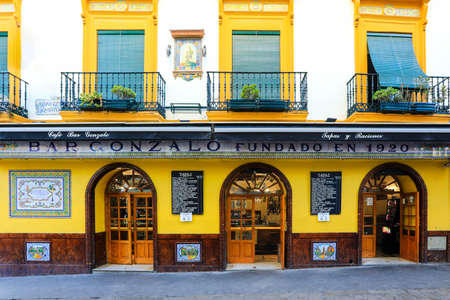 Seville, Spain - November 15, 2018: Colorful facades of old tapas restaurant in Seville on of the oldest town in Spain.のeditorial素材