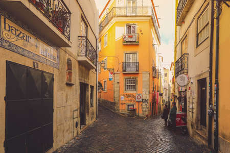 LISBON - PORTUGAL, December 25, 2018: A narrow street in Alfama district in Lisbon, Portugalのeditorial素材