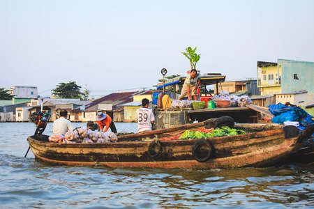 Mekong Delta - Vietnam - January 24, 2019 : Vietnamese vendors buying  vegetables on Nga Nam floating market in Mekong Delta Vietnam.のeditorial素材