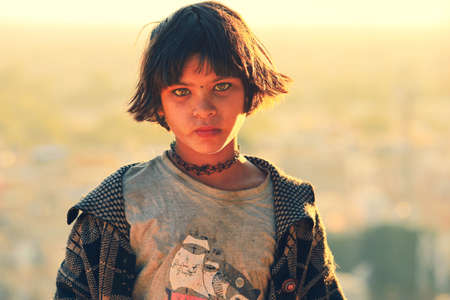 Portrait of young girl try to sell souvinir on street in rajasthan, Indiaのeditorial素材