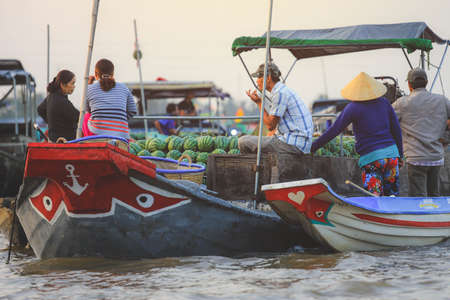 Mekong Delta - Vietnam - January 24, 2019 : Vietnamese vendors buying watermelon on Nga Nam floating market in Mekong Delta Vietnam.のeditorial素材