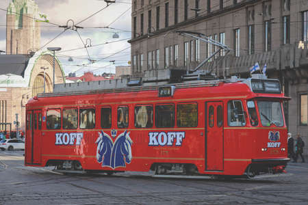 Helsinki, Finland - October 5, 2019 : Red tram transporting people in the central part of the Helsinki city, Finlandのeditorial素材