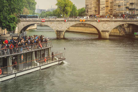Paris, France - 16 June 2019: Cruise ships with tourists in excursion on the Seine river, Parisのeditorial素材