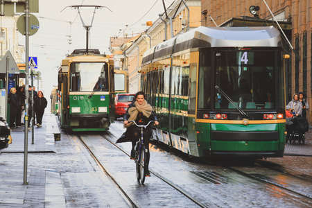 Helsinki, Finland - October 5, 2019 : Green tram transporting people in the central part of the Helsinki city, Finlandのeditorial素材