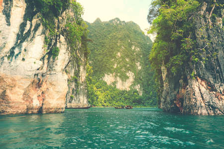 Beautiful view limestone mountains and lake from boat in Ratchaprapa dam, Khoa Sok National Park, Surat Thani, Thailandの写真素材