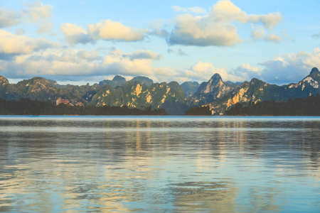 Panorama mountain limestone with its reflection at Ratchaprapha Dam In the morning, Khao Sok National Park, Suratthani, Thailandの写真素材