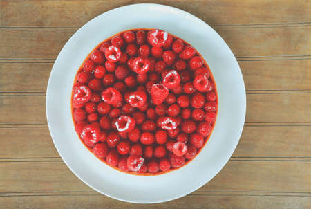 Top view of homemade rraspberries cake on white plateの写真素材