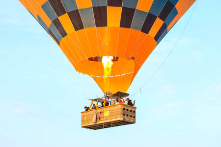 Cappadocia, Turkey - October 19, 2019 : tourists on hot air balloons flying over the valley at Cappadocia. Hot air balloons are traditional touristic attraction in Cappadocia.のeditorial素材