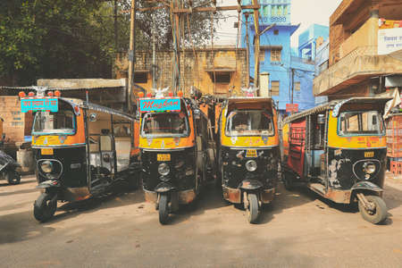 Jodhpur, India - January 19, 2020 : Auto rickshaw (tuk-tuk) taxis on a road. Tuk tuk taxis waiting at main square in Jodhpurのeditorial素材