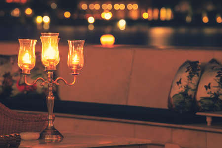 Romantic candle light dinner on table with bokeh background, Romantic dinner concept.の写真素材