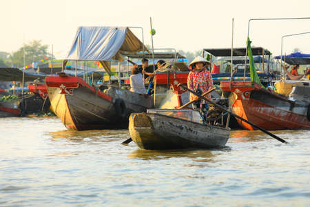 Mekong Delta - Vietnam - January 24, 2019: Vietnamese vendor rows up her boat on Nga Nam floating market in Mekong Delta Vietnam.のeditorial素材