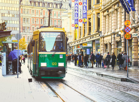 Helsinki, Finland - October 5, 2019: green tram transporting people in the central part of the Helsinki city, Finlandのeditorial素材