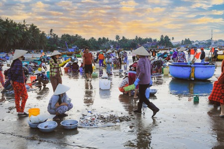 Mui ne Vietnam January 22, 2019: Early morning fishing village in Mui ne, full of Vietnamese vendor on the beachのeditorial素材