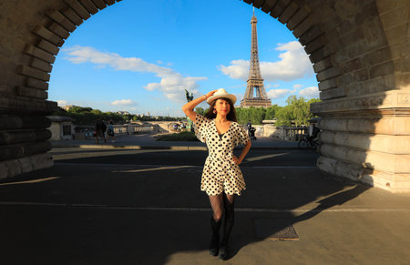 Paris, France - May 6, 2019: Tourist taking picture Pont de Bir-Hakeim with Eiffel tower on the back in Parisのeditorial素材