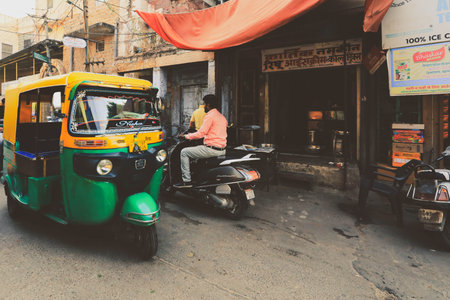 Jodhpur, India - January 19, 2020: Auto rickshaw (tuk-tuk) taxis on a road.のeditorial素材
