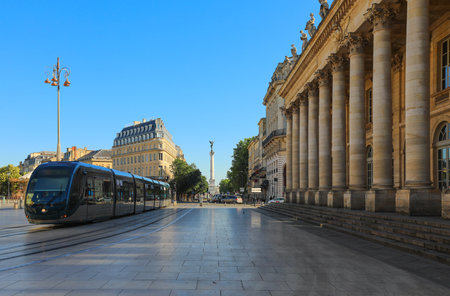 Tram is passing by Grand Theater de Bordeaux in France.のeditorial素材