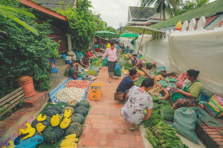 Luang Prabang, Laos - August 17. 2018: Local people selling vetgetables at the morning market in Luang Prabang, Laosのeditorial素材