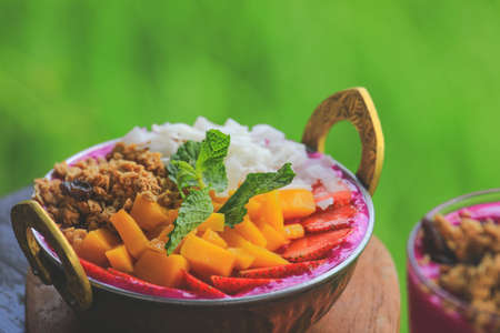 fruit salad on blended dragon fruit, yogurt or smoothie, healthy eating conceptの写真素材