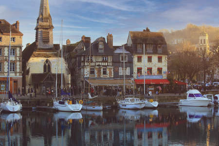 Honfleur, France - December 30, 2016: Morning light on buildings at Honfleur port is a truly picturesque and one of charming harbor in Franceのeditorial素材