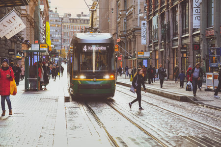 Helsinki, Finland - October 5, 2019: green tram transporting people in the central part of the Helsinki city, Finlandのeditorial素材