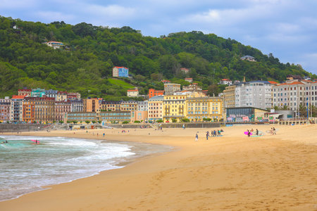 San Sebastian Spain - June 26 2021: People enjoy their vacation on the beach at the La Concha beach in the city of San Sebastian Basque country Spainのeditorial素材