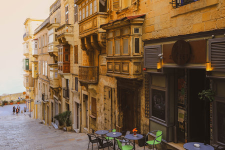 Valletta Malta - April 1 2018: Tiny cafes with tables on stairs of narrow street,Valletta, Maltaのeditorial素材