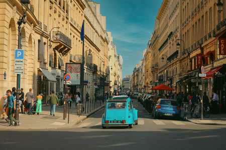 Paris, France - May 6, 2019: Selective focus on classic blue car, street view in the historical center of Paris, Franceのeditorial素材