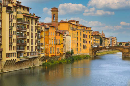 Houses and Carraia bridge on Arno river, Florence, Italyの写真素材