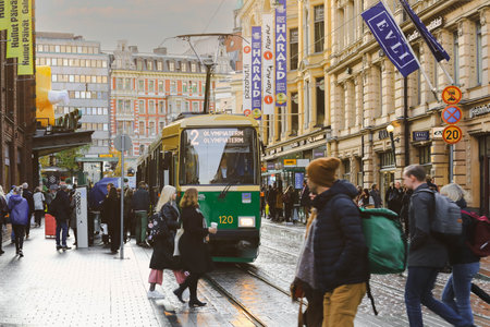Helsinki, Finland - October 5, 2019: green tram transporting people in the central part of the Helsinki city, Finlandのeditorial素材