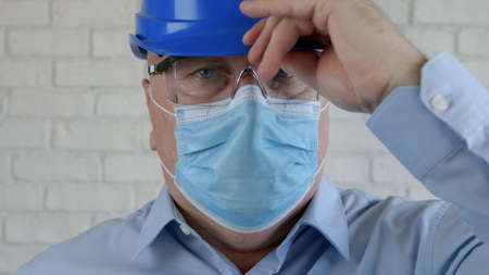 Confident Image with an Engineer Wearing Face Protection Mask Against Viruses.の写真素材