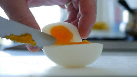Closeup Image with a Hot and Delicious Boiled Egg at Breakfast in the Morningの写真素材