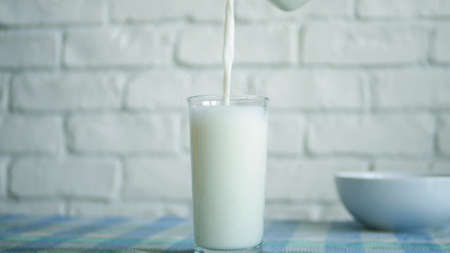 Image with a Glass with Fresh Milk at Breakfast in a Morningの写真素材
