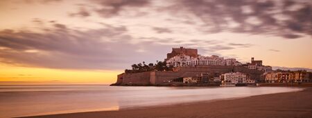 Panoramic of landscape with a castle, with calm sea.の写真素材