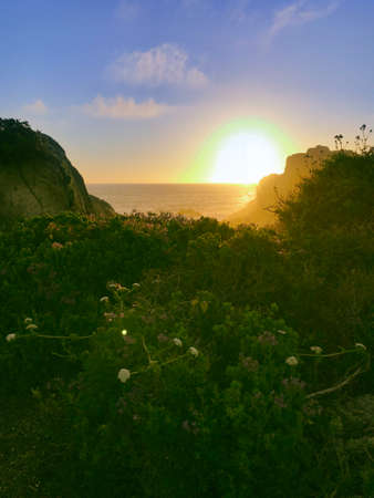 Beautiful sunset on the coastal edge of the beaches of Punta de Tralca beach, El Quisco,...