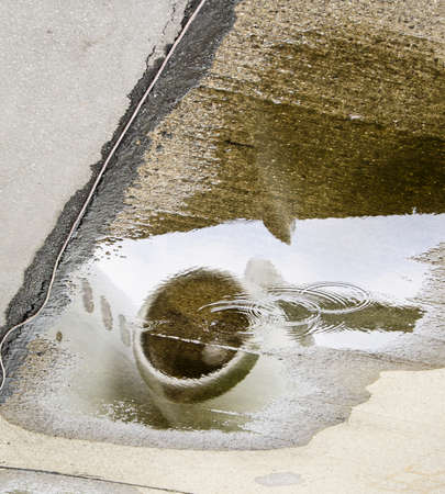 MD80 Airplane Engine Reflected in a Water Puddle の写真素材