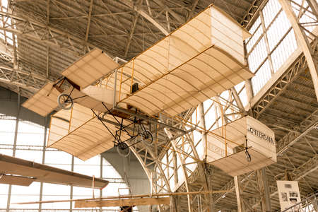 Vintage Airplane Inside A Hangar and Holding from the Roofのeditorial素材