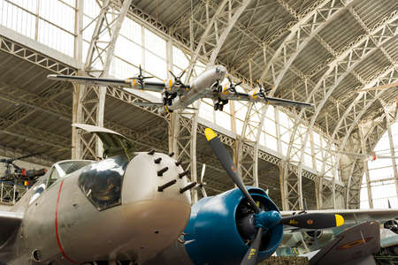 Vintage Airplane Inside A Hangar with Machine Gun on the Nose