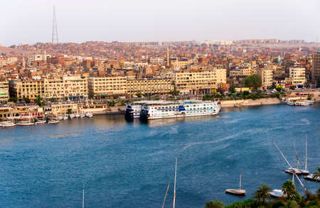 Nile River by Aswan City skyline with Boatsのeditorial素材