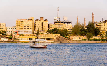 Nile River commercial life by Aswan City with Boatsのeditorial素材