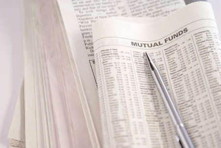 Financial or economy concept with newspaper, pen, and notepadの写真素材