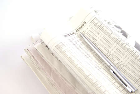 Financial or economy concept with newspaper showing Mutal Funds and silver pen laying on top. Low depth.の写真素材