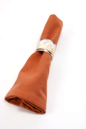 Cloth napkin with decorative napkin ring. On whiteの写真素材