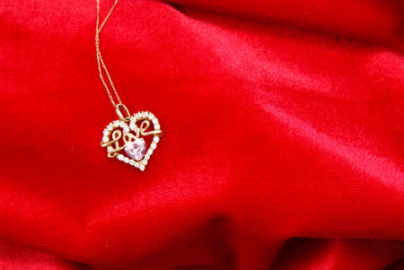 Gold and diamond necklace on red velvetの写真素材