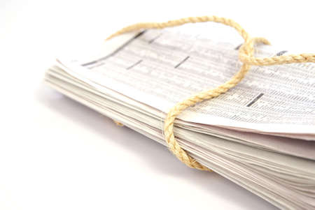Recycle concept. Old newspaper bundled with twine ropeの写真素材