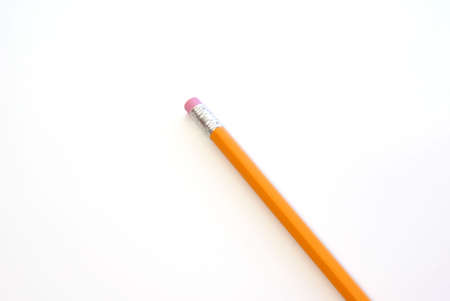 New yellow wood pencil with eraser on whiteの写真素材