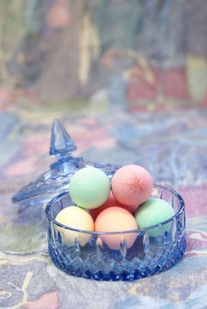Pastel easter eggs in blue cut crystal candy dish